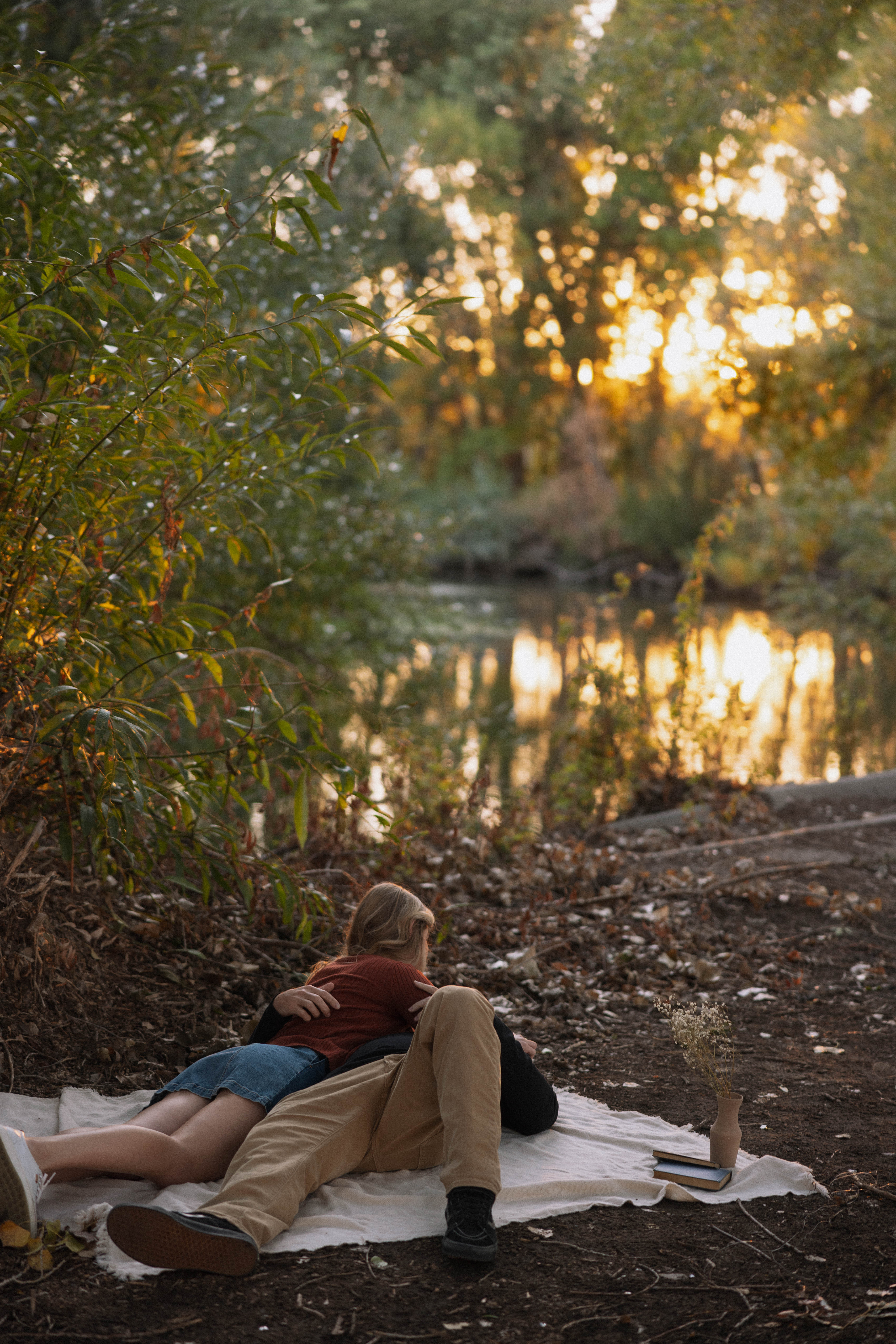 in love couple walking through a dreamy river park in utah during sunset